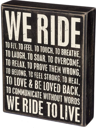 We Ride box sign