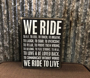 We Ride box sign